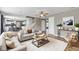 Spacious living room featuring a ceiling fan, hardwood floors, and comfortable couches at 3652 Newberry Rd, Plainfield, IN 46168