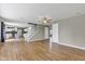 Open living room with view of kitchen, stairs, and multiple entryways at 3652 Newberry Rd, Plainfield, IN 46168