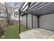 Cozy backyard featuring a concrete patio, lush green lawn, and a stylish pergola for outdoor relaxation and enjoyment at 3845 Cornelius Ave, Indianapolis, IN 46208