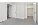 A well-lit bedroom with neutral walls and plush carpet includes convenient closet space for ample storage at 3845 Cornelius Ave, Indianapolis, IN 46208