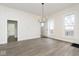 Bright dining room featuring hardwood floors and access to other rooms at 3845 Cornelius Ave, Indianapolis, IN 46208