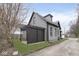 View of the home's exterior highlighting the siding, window trim, and backyard pergola at 3845 Cornelius Ave, Indianapolis, IN 46208