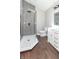 Stylish bathroom with walk-in shower with geometric tiles and a modern vanity and light fixtures at 400 N Sycamore St, Martinsville, IN 46151
