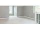 Bright bedroom with fresh carpets, neutral paint, wainscoting, and plenty of natural light at 400 N Sycamore St, Martinsville, IN 46151