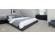Elegant bedroom with modern furniture, neutral color scheme, and plenty of natural light for a relaxing retreat at 400 N Sycamore St, Martinsville, IN 46151