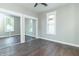 Inviting bedroom with a ceiling fan, mirrored closet doors and natural light from the window at 400 N Sycamore St, Martinsville, IN 46151