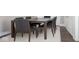Well-lit dining room with dark wood furniture and neutral-colored walls for a modern look at 400 N Sycamore St, Martinsville, IN 46151
