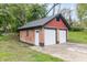 Detached two-car garage with brick and red siding at 400 N Sycamore St, Martinsville, IN 46151