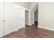 Neutral hallway offering storage with multiple closets and leading to other rooms at 400 N Sycamore St, Martinsville, IN 46151