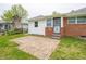 Backyard area showing a brick patio and the home's clean, white and brick exterior at 4029 N Euclid Ave, Indianapolis, IN 46226