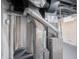 Interior shot of a basement mechanical room featuring a furnace, hot water heater and duct work at 4029 N Euclid Ave, Indianapolis, IN 46226