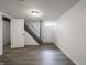 Basement with vinyl flooring and access to the upper level through stairs at 4029 N Euclid Ave, Indianapolis, IN 46226