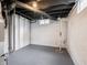 Unfinished basement area with painted walls, mechanicals, and sump pump at 4029 N Euclid Ave, Indianapolis, IN 46226