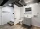 Basement bathroom featuring a modern vanity, toilet, and tiled walk-in shower with black hardware at 4029 N Euclid Ave, Indianapolis, IN 46226