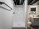 Tiled walk-in shower with black hardware in the finished basement bathroom at 4029 N Euclid Ave, Indianapolis, IN 46226