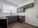 Updated kitchen with gray cabinets, stainless steel appliances, and new counters at 4029 N Euclid Ave, Indianapolis, IN 46226