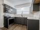 Modern kitchen featuring stainless steel appliances, tile backsplash, and new counters at 4029 N Euclid Ave, Indianapolis, IN 46226