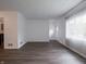 Open living room featuring wood-look flooring, white walls, and natural light at 4029 N Euclid Ave, Indianapolis, IN 46226