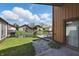 Charming backyard view with a wooden deck, canal, and well-maintained landscaping for a serene outdoor experience at 4107 Zinfandel Way, Indianapolis, IN 46254