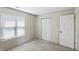 Cozy bedroom with carpet, a window with blinds, and a closet for ample storage space at 4107 Zinfandel Way, Indianapolis, IN 46254