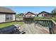 Wooden deck overlooking a calm canal with charming homes in the background offering serene waterfront living at 4107 Zinfandel Way, Indianapolis, IN 46254