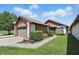 Charming home featuring a two-car garage and manicured landscaping, inviting curb appeal at 4107 Zinfandel Way, Indianapolis, IN 46254