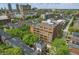 Building exterior, showing its place within a neighborhood setting with mature trees and proximity to downtown at 430 N Park Ave # 103, Indianapolis, IN 46202