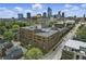 Stunning aerial view of the building with a city skyline backdrop on a partly cloudy day at 430 N Park Ave # 103, Indianapolis, IN 46202