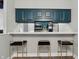 Kitchen featuring a bar with seating and stainless steel appliances at 430 N Park Ave # 103, Indianapolis, IN 46202
