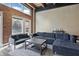 Bright living room with exposed brick, large windows, and a comfortable seating area at 430 N Park Ave # 103, Indianapolis, IN 46202