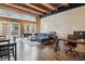 Expansive living room featuring wood floors, exposed brick, large windows and modern furnishings at 430 N Park Ave # 103, Indianapolis, IN 46202