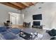Comfortable living room featuring sleek furniture, a large television, and modern decor at 430 N Park Ave # 103, Indianapolis, IN 46202