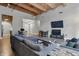 Open-concept living room with neutral colors, modern furniture, a television, and wood floors at 430 N Park Ave # 103, Indianapolis, IN 46202
