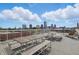 This rooftop deck boasts plenty of seating with benches and tables for residents to enjoy and relax in warmer weather at 430 N Park Ave # 103, Indianapolis, IN 46202