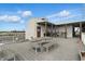 This rooftop deck includes a table with benches, a grill and additional seating for residents to enjoy at 430 N Park Ave # 103, Indianapolis, IN 46202