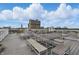 This rooftop deck boasts plenty of seating with benches and tables for residents to enjoy in warmer weather at 430 N Park Ave # 103, Indianapolis, IN 46202