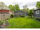 Backyard view with lush lawn, landscaping, and a fenced perimeter at 440 Linden St, Zionsville, IN 46077