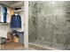 Elegant bathroom with walk-in shower, tiled walls, and organized closet space at 440 Linden St, Zionsville, IN 46077
