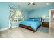 Bright bedroom with large window, hardwood floors, and comfortable bed at 440 Linden St, Zionsville, IN 46077