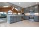Spacious kitchen features stainless steel appliances, granite countertops, and wood ceiling at 440 Linden St, Zionsville, IN 46077