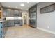 Modern kitchen with stainless steel appliances, gray cabinets, subway tile backsplash, and hardwood floors at 440 Linden St, Zionsville, IN 46077