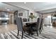 Open-concept space showcasing dining room, kitchen with stainless steel appliances, and living area at 440 Linden St, Zionsville, IN 46077