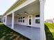 Covered back porch with ceiling fans, recessed lighting, and views of the backyard at 4734 Cleome Dr, Plainfield, IN 46168