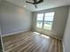 Spacious bedroom with two windows allowing ample natural light and featuring a ceiling fan at 4734 Cleome Dr, Plainfield, IN 46168