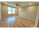 Spacious bedroom with ceiling fan, recessed lighting, and wood-look flooring at 4734 Cleome Dr, Plainfield, IN 46168