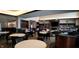 Clubhouse interior with tables, chairs, a fireplace, and a well stocked library at 4734 Cleome Dr, Plainfield, IN 46168