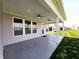 Covered patio with ceiling fans, offering a relaxing outdoor living space with an attached yard at 4734 Cleome Dr, Plainfield, IN 46168