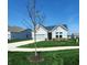 Well-maintained single-Gathering home with a neat lawn, driveway and an attached garage at 4734 Cleome Dr, Plainfield, IN 46168