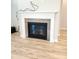 Stylish fireplace with a white mantel and grey stone hearth at 4734 Cleome Dr, Plainfield, IN 46168