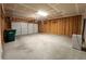 Spacious two car garage featuring an automatic garage door opener and concrete floor at 4734 Cleome Dr, Plainfield, IN 46168